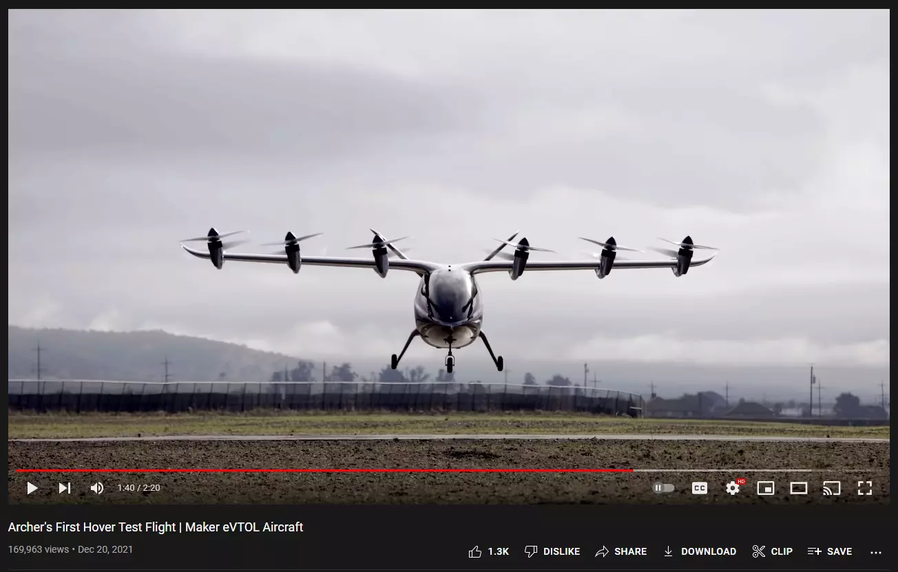 A helicopter flying over a field Description automatically generated with low confidence